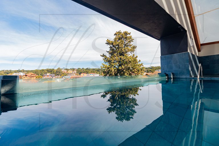 Apto com lareira, piscina e localização