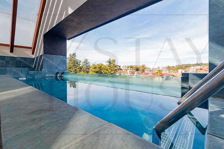 Apto com lareira, piscina e localização